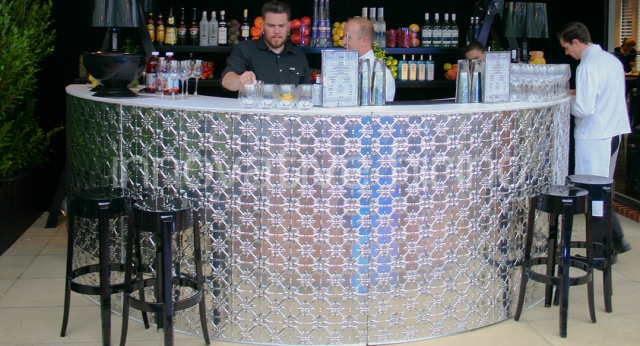 Features: Circular Pressed Metal Bar with Charles Ghost Stools
