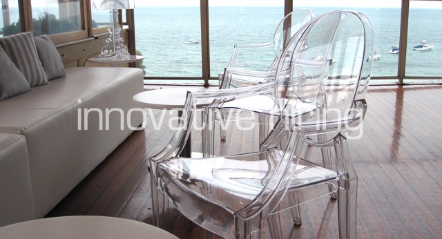 Features: Louis Ghost Chair with White Ottomans