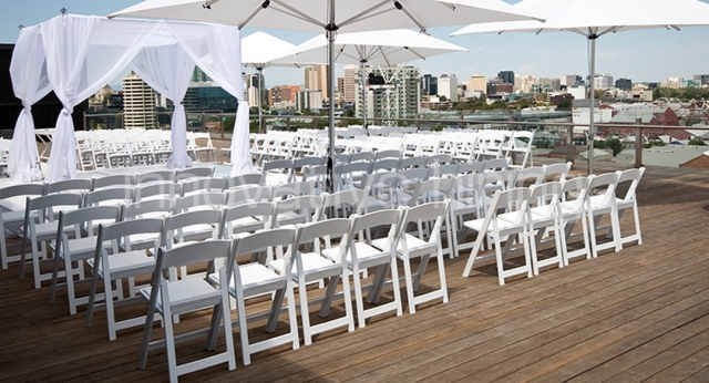 Features: Market Umbrellas with Padded Folding Chairs